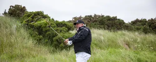 Darren Clarke playing golf