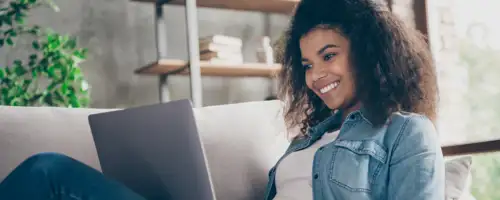 Lady smiling at laptop