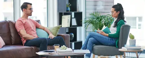 Two people sat opposite each other