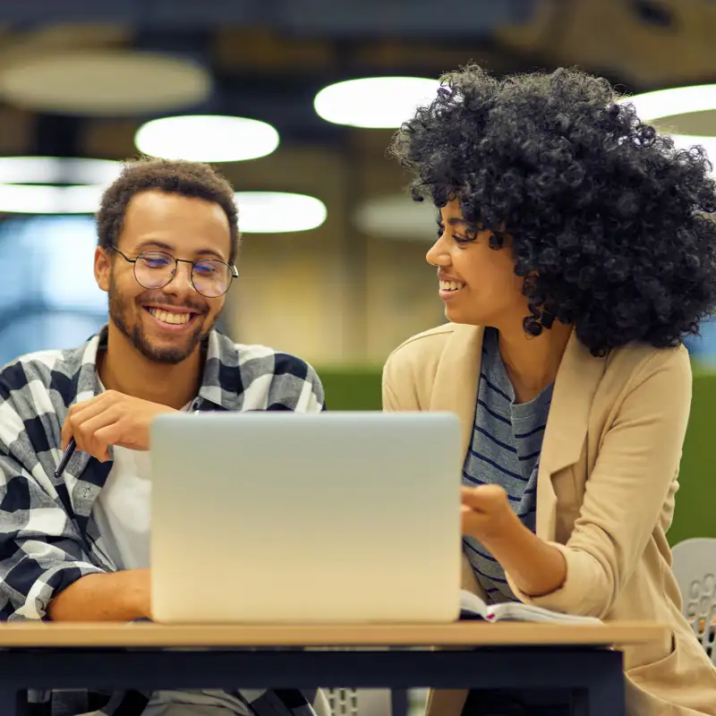 Two people with laptop