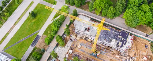 Construction site in a city with greenery